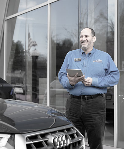 Man Looking at a Car