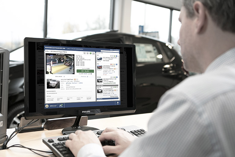 Man sitting at desk typing on computer